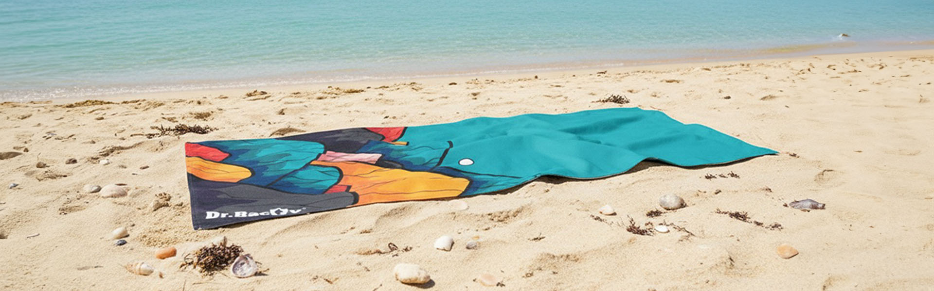 Ręcznik Dr.Bacty na plaży